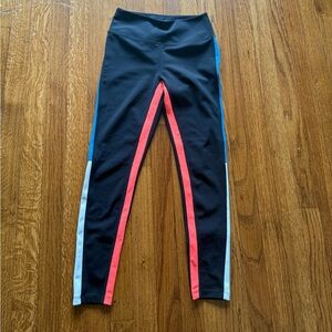 Black capris with blue and orange detailing